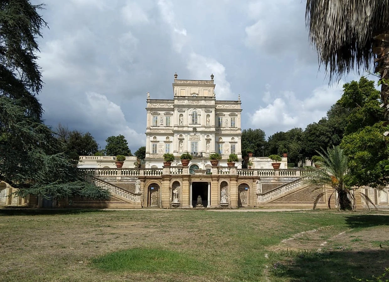 Facade of the Casino del Bel Respiro in Villa Doria Pamphilj, Rome, showing a double staircase and statues.