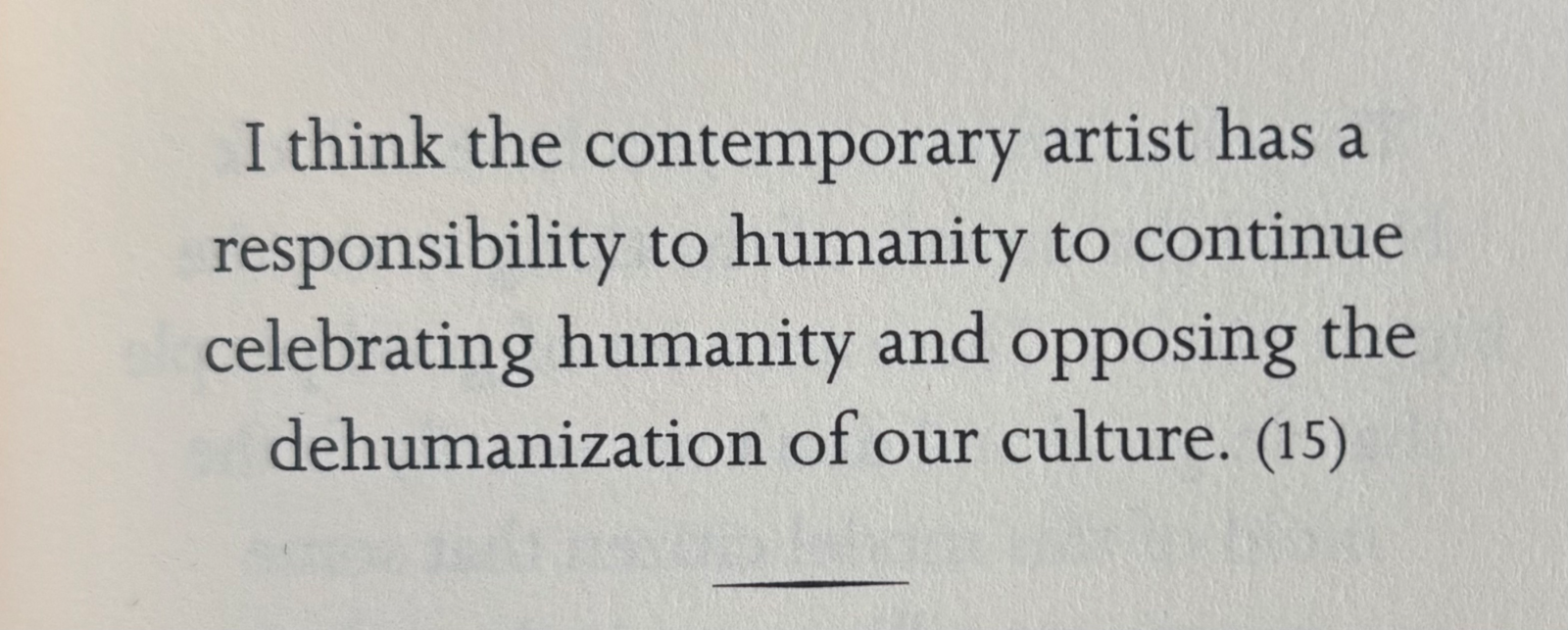 Printed quote about a contemporary artist's responsibility to celebrate humanity and oppose dehumanization.